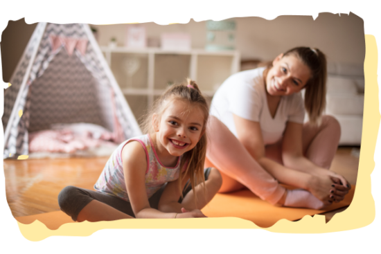 A girl and a teacher are practicing yoga